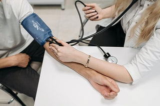 doctor checking blood pressure