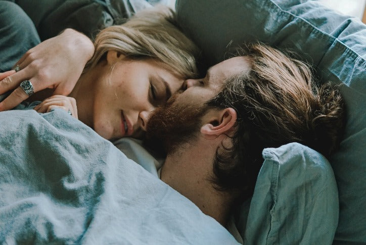 Couple Cuddling in Bed