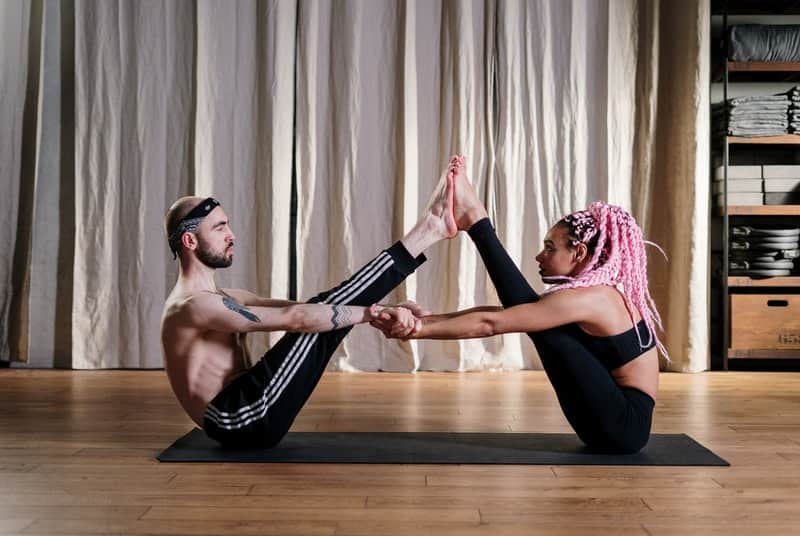 Couple stretching to get ready for scissoring