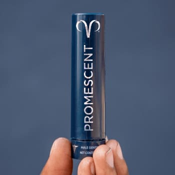 Bottle of Promescent Delay Spray for men in a person hand