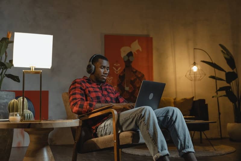 Man on laptop researching porn induced erectile dysfunction