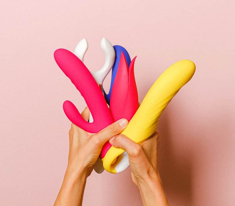 Person holding sex toys for kivin method