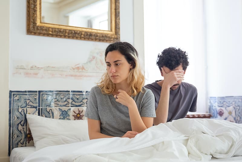 Sexually frustrated woman in bed with man that as whiskey dick